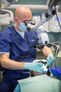 dental staff working with advanced technology